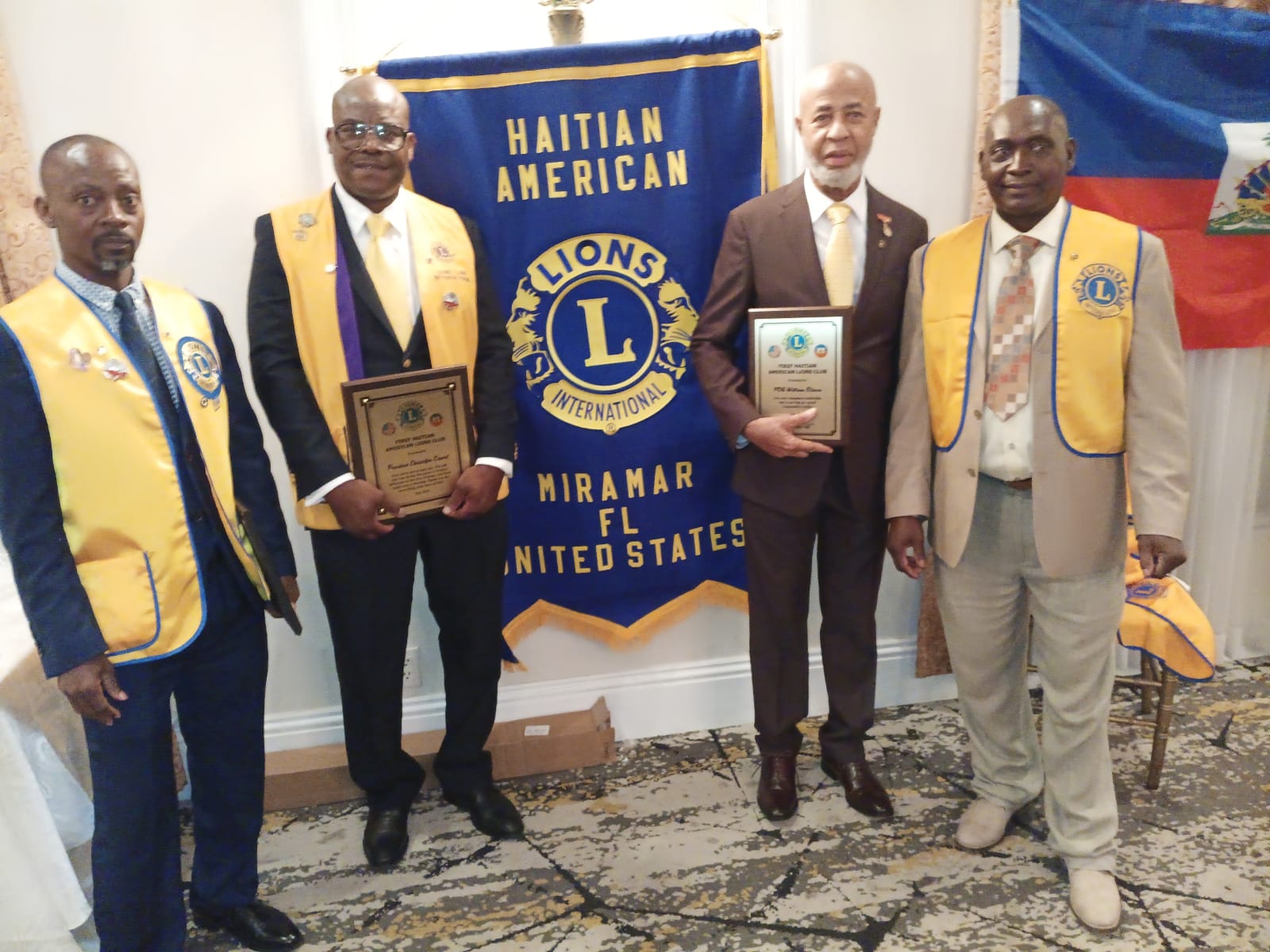 Charter members with plaques at the inauguration
